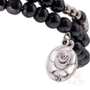 Bracciale a spirale in ematite con perle e medaglia di Santa Rita