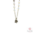 Bracciale Santa Rita Grani in Mezzo Cristallo Bianco, Rosa in Pasta di Corallo e Medaglia