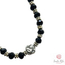 Bracciale Elastico Santa Rita con Grani Neri in Mezzo Cristallo e Medaglia 🌹