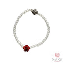 Bracciale Elastico Santa Rita con Grani in Mezzo Cristallo Sfaccettato, Rosa in Pasta di Corallo e Medaglia 🌹