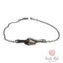 Bracciale in Argento 925 con Mani Intrecciate e Zirconi Ispirato alla Fede Nuziale di Santa Rita da Cascia | Artigianato Umbro