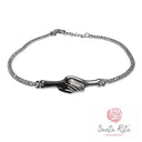 Bracciale Tennis in Argento 925 con Zirconi e Mani Intrecciate Ispirato alla Fede Nuziale di Santa Rita da Cascia | Artigianato Umbro