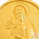 Dettaglio del volto di Santa Rita sulla medaglia in oro 9 kt